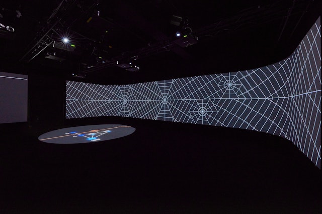 Hexagonal grid projected on the walls.